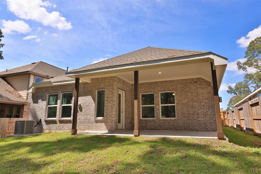 Exterior details and patio area of a home in The Woodlands Hills, Willis (Image 19). Exterior details and patio area of a home in The Woodlands Hills, Willis (Image 19).