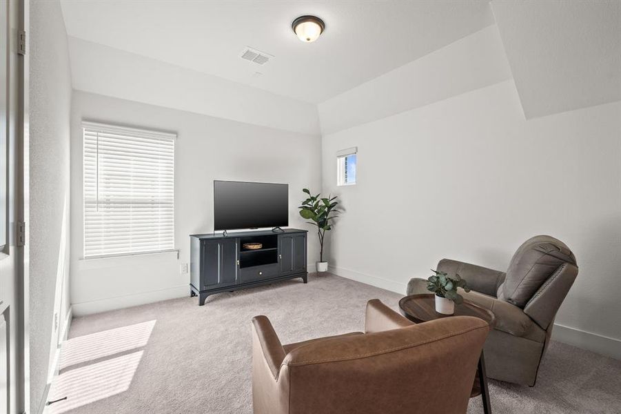 Living room with carpet and baseboards Living room with carpet and baseboards