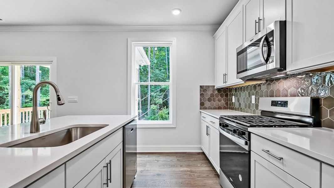 Representative furnished interior of a home built from the Edisto by D.R. Horton in Horton Park, Apex (Image 8).