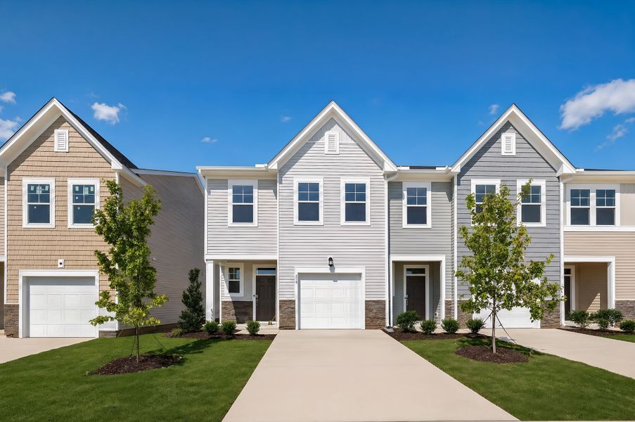 Front exterior of a new home in Myrtle Meadows Townes, Angier, NC, highlighting curb appeal (Image 1). Front exterior of a new home in Myrtle Meadows Townes, Angier, NC, highlighting curb appeal (Image 1).