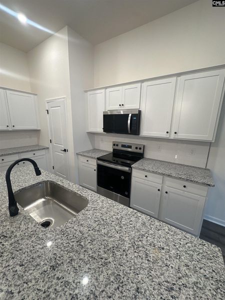 Furnished interior view inside a new home in Piney Woods Bluff, Columbia (Image 5).