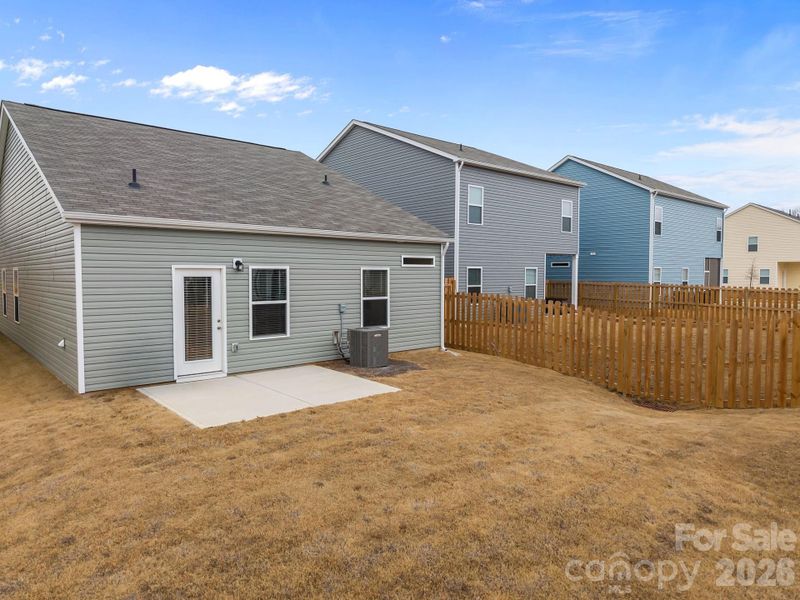 Exterior details and patio area of a home in Country Club Village, Salisbury (Image 23).
