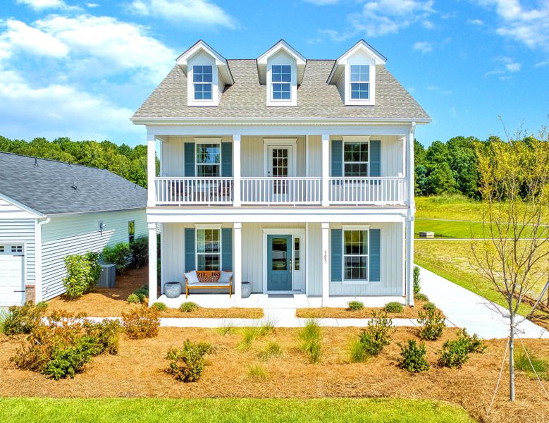 Front exterior of a new home in Six Oaks, Summerville, SC, highlighting curb appeal (Image 1). Front exterior of a new home in Six Oaks, Summerville, SC, highlighting curb appeal (Image 1).