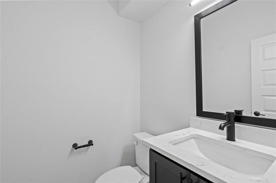 Bathroom with vanity and toilet