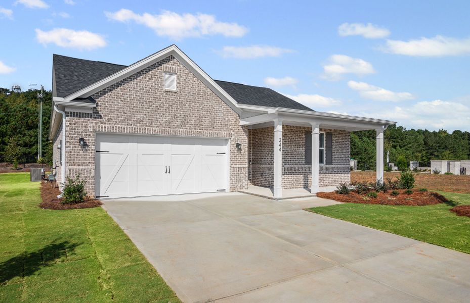 Front exterior of a new home in Overland, Locust Grove, GA, highlighting curb appeal (Image 1).