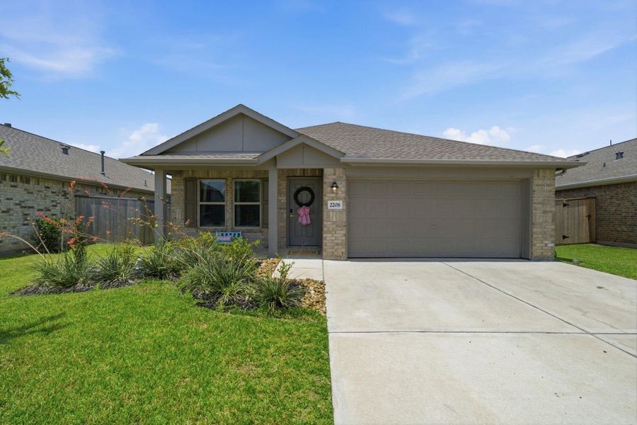 Front exterior of a new home in Samara, League City, TX, highlighting curb appeal (Image 18). Front exterior of a new home in Samara, League City, TX, highlighting curb appeal (Image 18).
