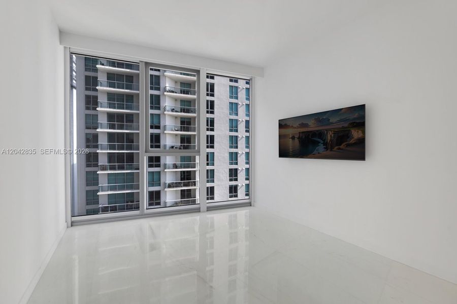 Spacious, unfurnished interior of a new home in Aston Martin Residences, Miami (Image 38).