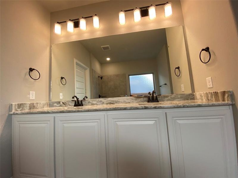 Dual granite master bath vanity with ORB fixtures & lighting