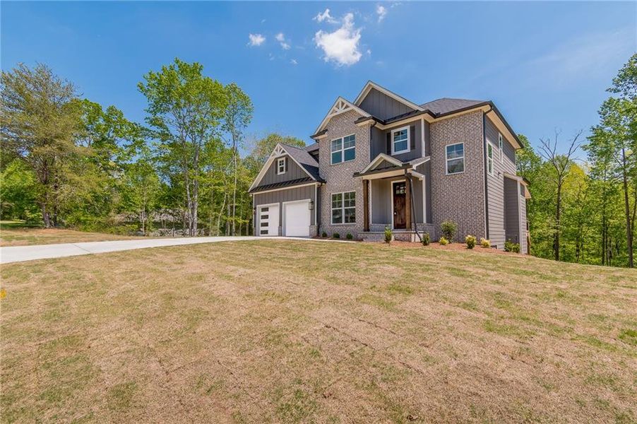 Front exterior of a new home in , Gainesville, GA, highlighting curb appeal (Image 2). Front exterior of a new home in , Gainesville, GA, highlighting curb appeal (Image 2).