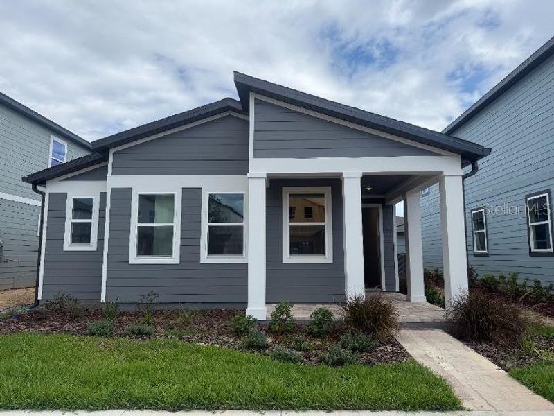 Front exterior of a home in the Northlake Classical community, located in Winter Garden, FL (Image 8).