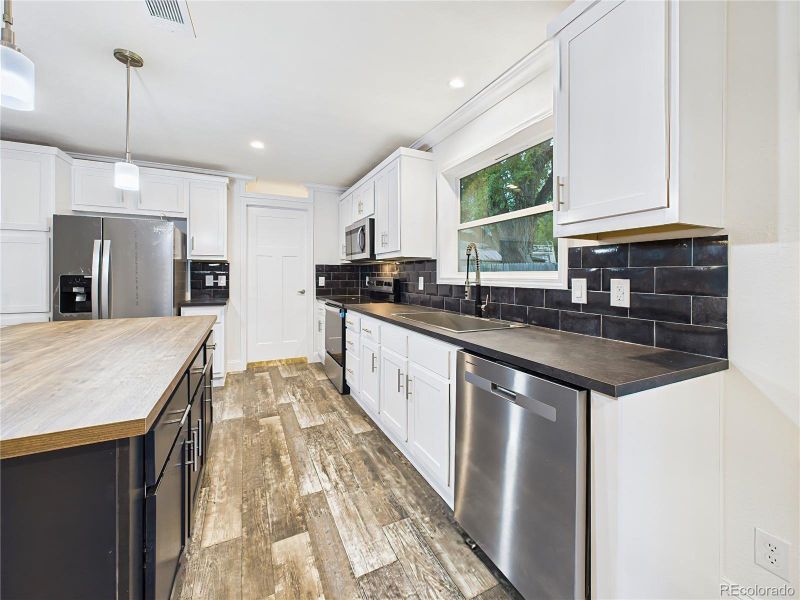 Stainless steel appliances, pendant lighting add both function and style.