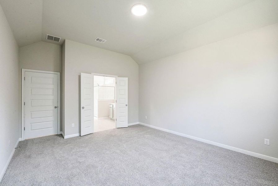 Primary Bedroom in the Willow home plan by Trophy Signature Homes – REPRESENTATIVE PHOTO