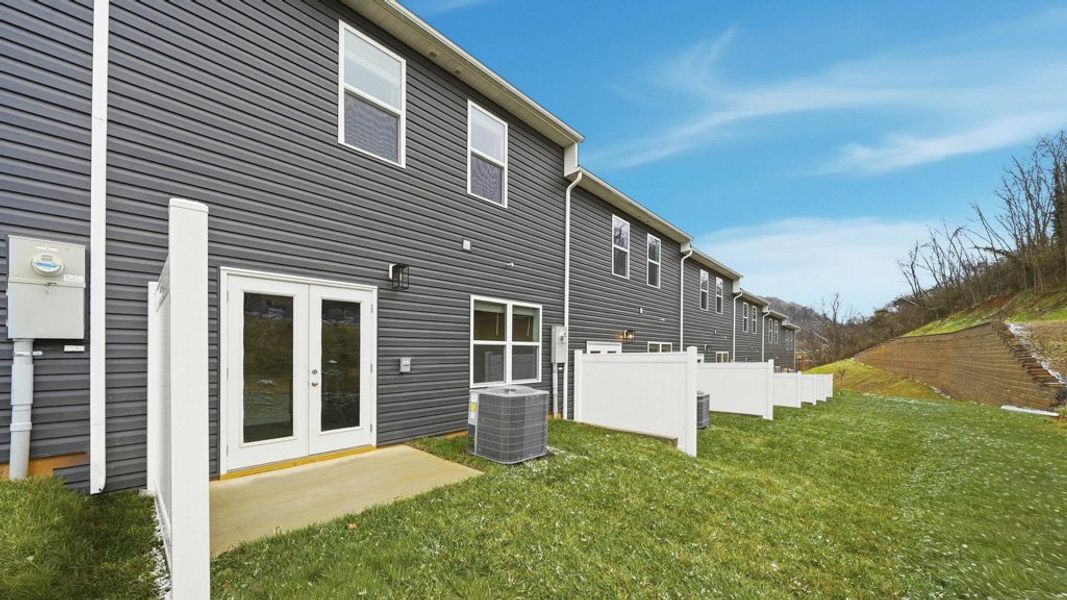 Exterior details and patio area of a home in The Arbor Townhomes, Kingsport (Image 17).