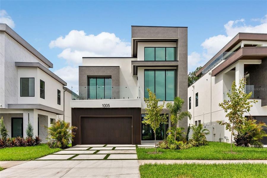 Front exterior of a new home in , Tampa, FL, highlighting curb appeal (Image 27).