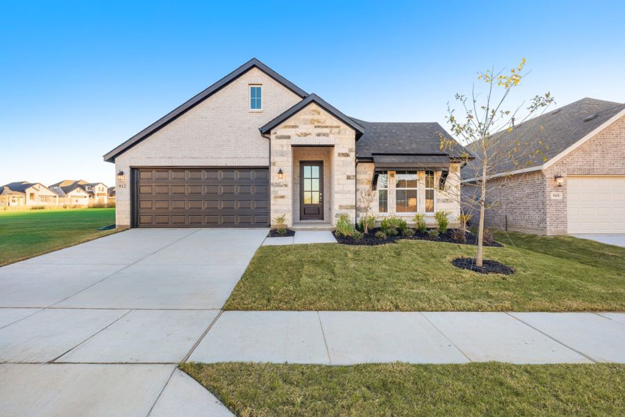Front exterior of a new home in Elevon, Lavon, TX, highlighting curb appeal (Image 1). Front exterior of a new home in Elevon, Lavon, TX, highlighting curb appeal (Image 1).