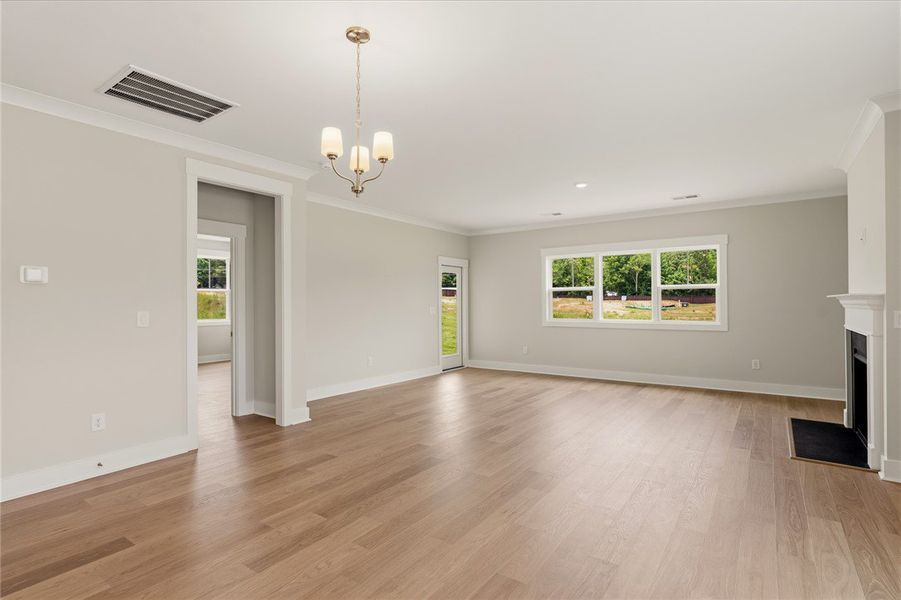 Sun-filled living area featuring rich hardwood flo