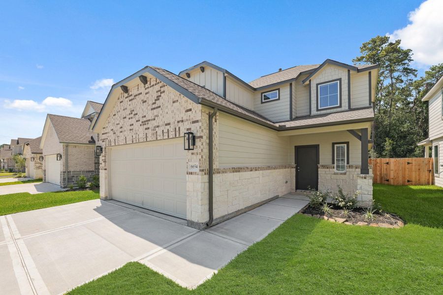 Front exterior of a new home in Cypresswood Landing, Humble, TX, highlighting curb appeal (Image 20).