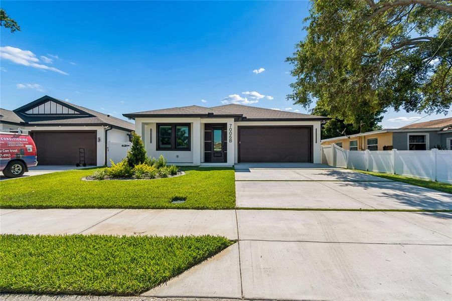 Front exterior of a new home in , Tampa, FL, highlighting curb appeal (Image 28).