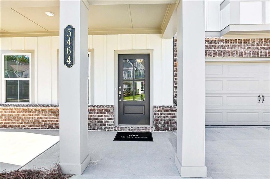 Exterior details and patio area of a home in Eastlyn Crossing, Flowery Branch (Image 17).