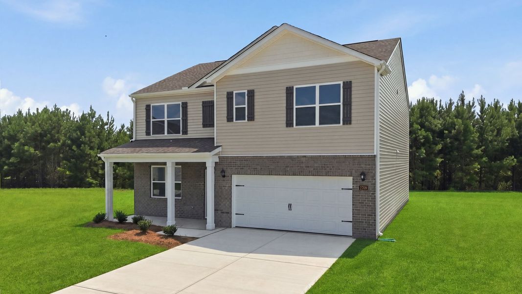 Front exterior of a new home in Villa Grande, Winterville, NC, highlighting curb appeal (Image 16).