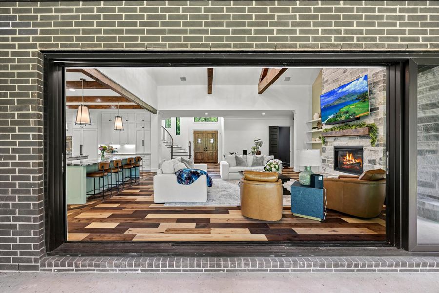 Expansive sliding glass doors draw in a curated outdoor view, enhancing the room’s refined aesthetic and seamless indoor-outdoor flow. Expansive sliding glass doors draw in a curated outdoor view, enhancing the room’s refined aesthetic and seamless indoor-outdoor flow.
