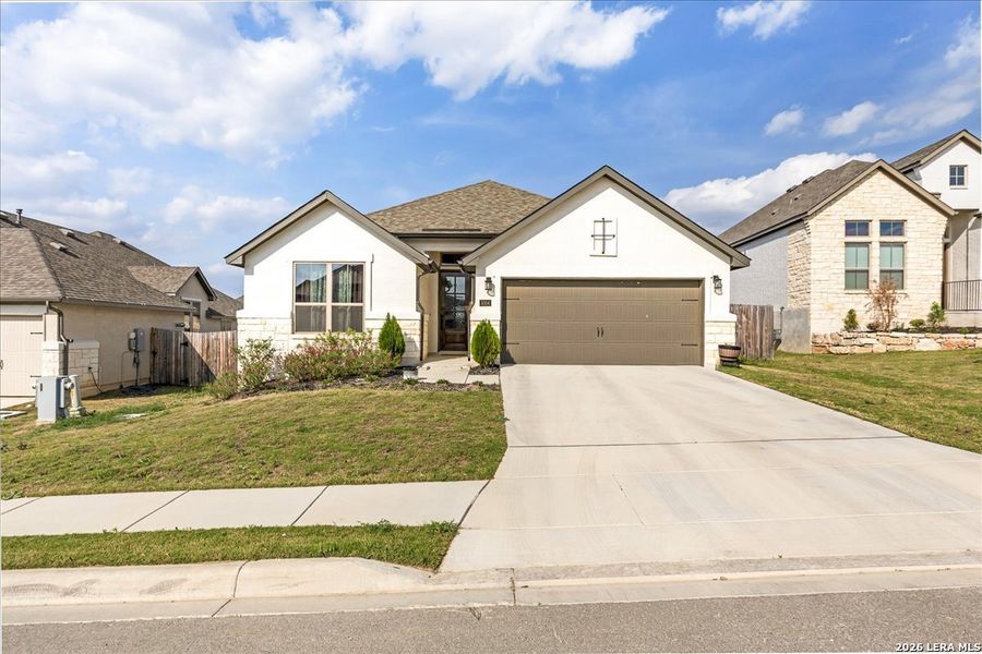 Front exterior of a new home in , Bulverde, TX, highlighting curb appeal (Image 23).