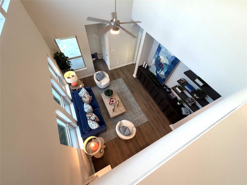 Overlook from second floor game room with great view of family room that showcases 20ft ceilings for an open, roomy feel.