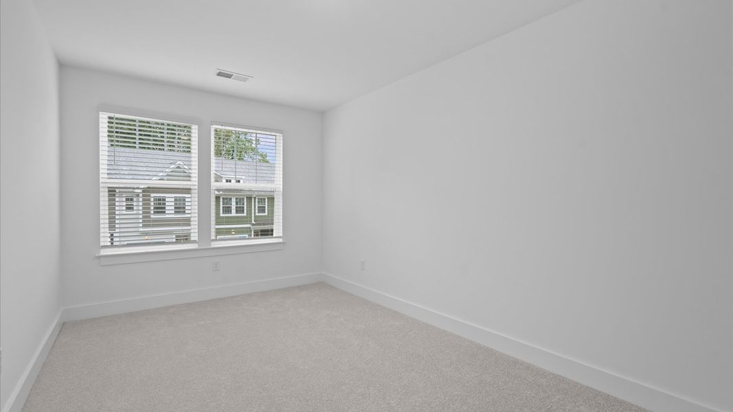 First-class bedroom with generous proportions, a walk-in closet, and beautiful natural light through large windows First-class bedroom with generous proportions, a walk-in closet, and beautiful natural light through large windows