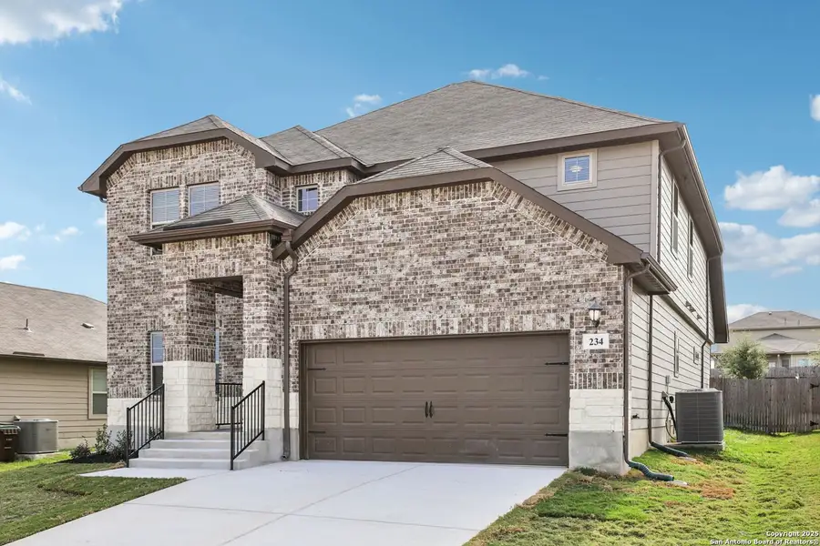 Front exterior of a new home in Legendary Trails - Classic Series, Cibolo, TX, highlighting curb appeal (Image 1). Front exterior of a new home in Legendary Trails - Classic Series, Cibolo, TX, highlighting curb appeal (Image 1).