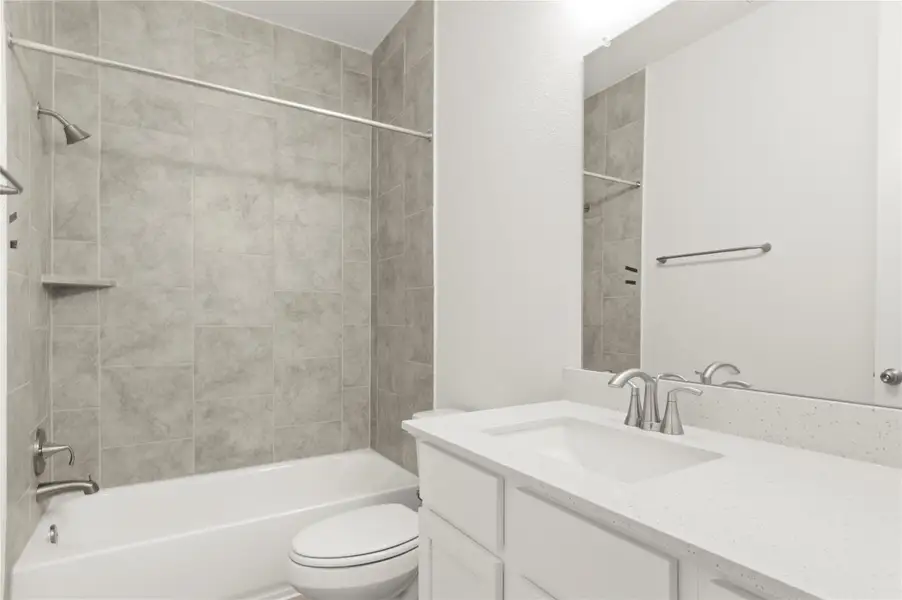 Bathroom featuring vanity and tub / shower combination