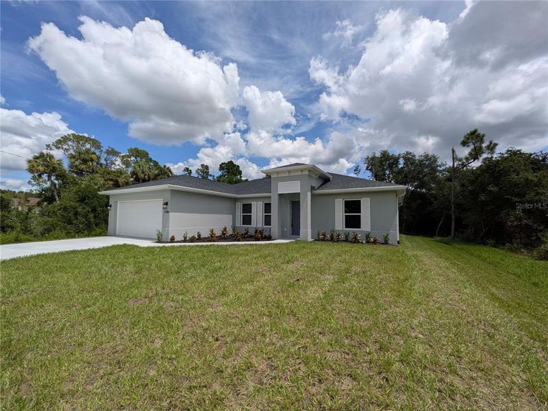 Front exterior of a new home in , North Port, FL, highlighting curb appeal (Image 25). Front exterior of a new home in , North Port, FL, highlighting curb appeal (Image 25).