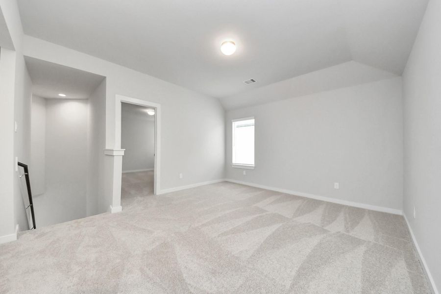 Come upstairs and enjoy a day of leisure in this fabulous game room! This is the perfect hangout spot or adult game room! Features plush carpet, high ceilings, custom paint and windows for plenty of natural light. Come upstairs and enjoy a day of leisure in this fabulous game room! This is the perfect hangout spot or adult game room! Features plush carpet, high ceilings, custom paint and windows for plenty of natural light.