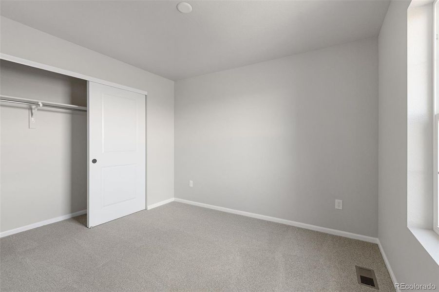 Spacious, unfurnished interior of a new home in The Legacy Collection at Talon Pointe, Thornton (Image 28).