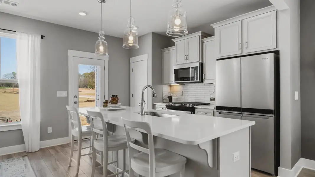 Luxe 2 story townhomes with garage,  elevated ceilings, walk-in closets, & 9-foot kitchen island near Downtown Greenville, SC