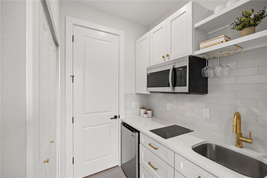 In-law suite kitchenette and closet and access to the main home In-law suite kitchenette and closet and access to the main home