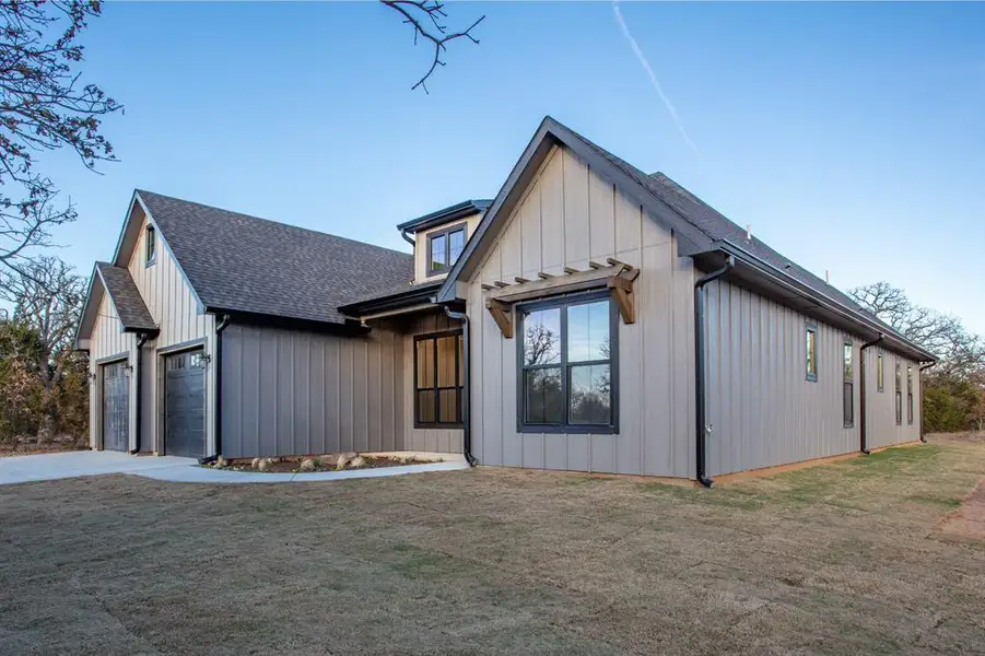 Curb appeal! Lots of soothing neutral colors for this stunning home on a spectacular lot!