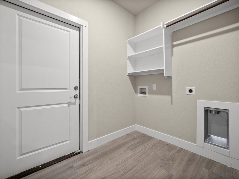 Washroom with light wood-style flooring, washer hookup, and electric dryer hookup Washroom with light wood-style flooring, washer hookup, and electric dryer hookup