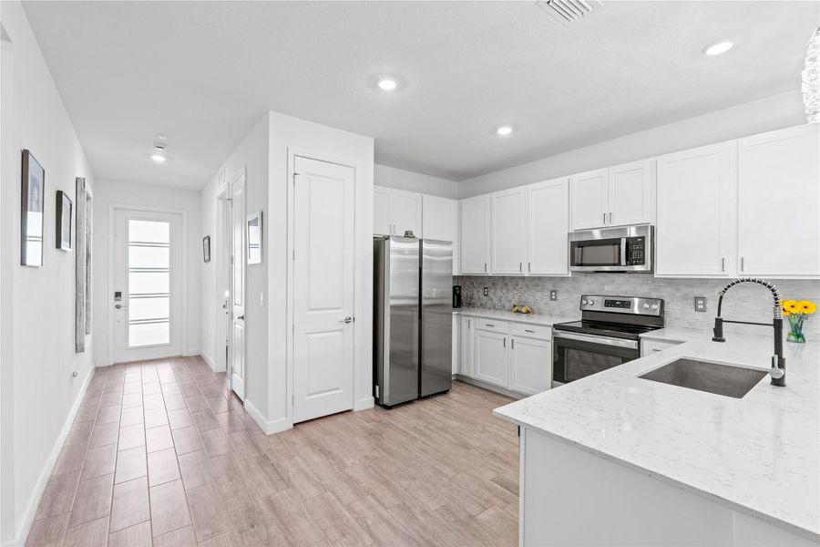 Furnished interior view inside a new home in Delray Trails: The Woods, Delray Beach (Image 7). Furnished interior view inside a new home in Delray Trails: The Woods, Delray Beach (Image 7).