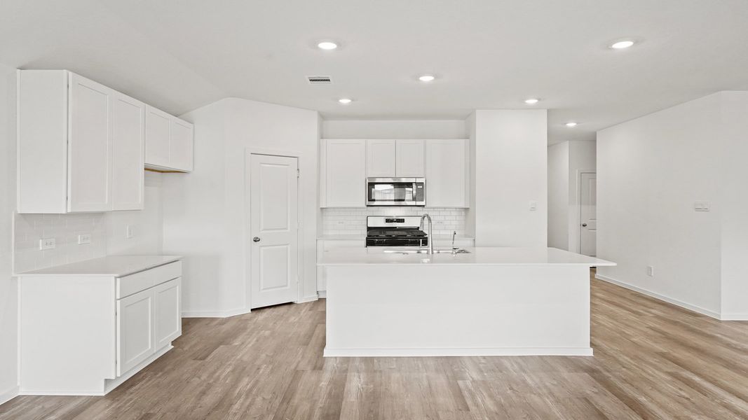 Furnished interior view inside a new home in Sunterra, Katy (Image 8).