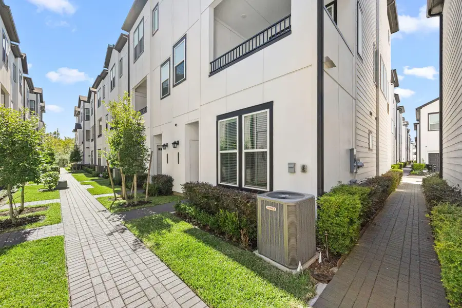 Exterior details and patio area of a home in The Corner At Buffalo Pointe, Houston (Image 2).