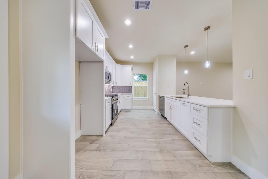 Brand new dishwasher and modern lighting, designed for convenience and style in your kitchen. Brand new dishwasher and modern lighting, designed for convenience and style in your kitchen.