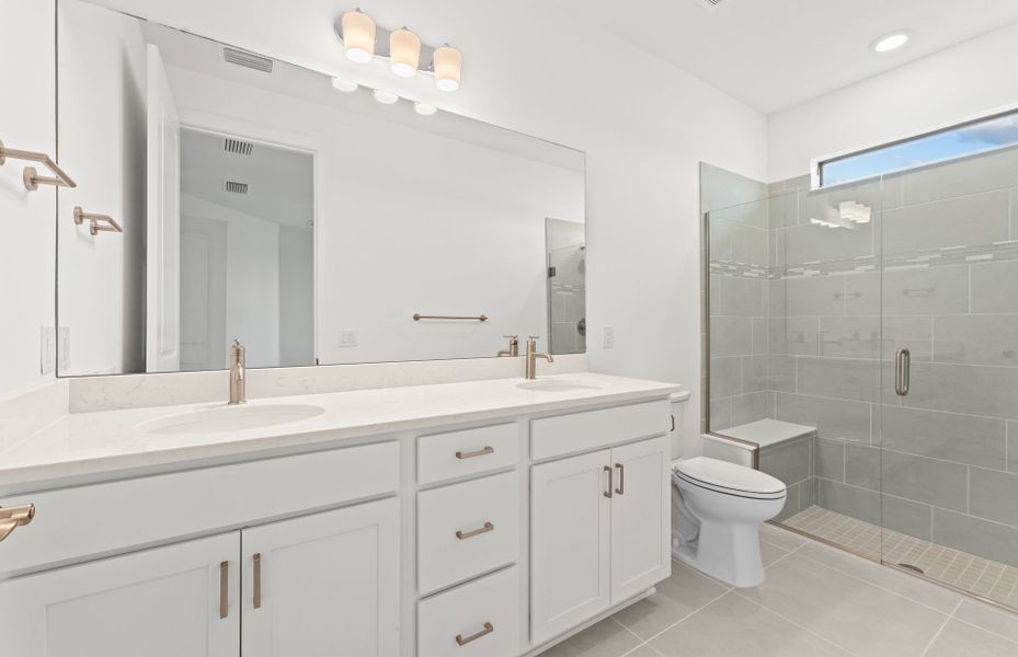 Owner's suite bathroom with dual-sink vanity Owner's suite bathroom with dual-sink vanity