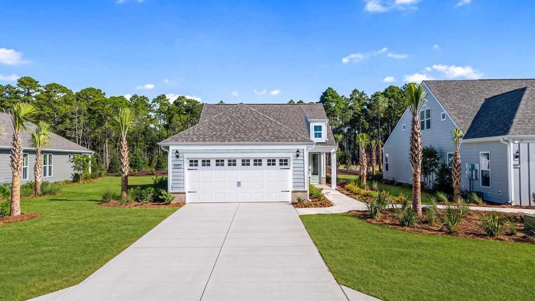 Representative exterior photo of a completed home built from the Compass by Del Webb in Del Webb Ocean Isle Beach, Shallotte, NC (Image 22).