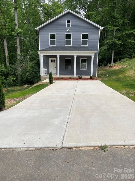 Front exterior of a new home in , Statesville, NC, highlighting curb appeal (Image 19).