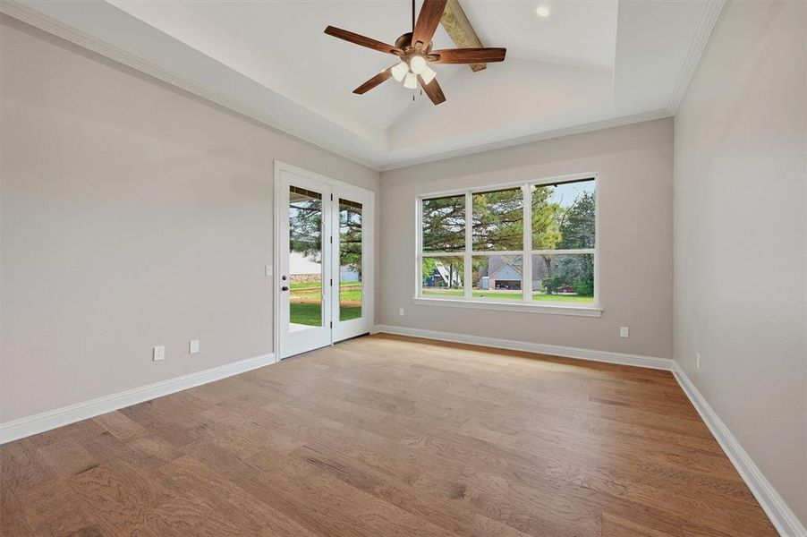 Bedroom with double doors to the back patio