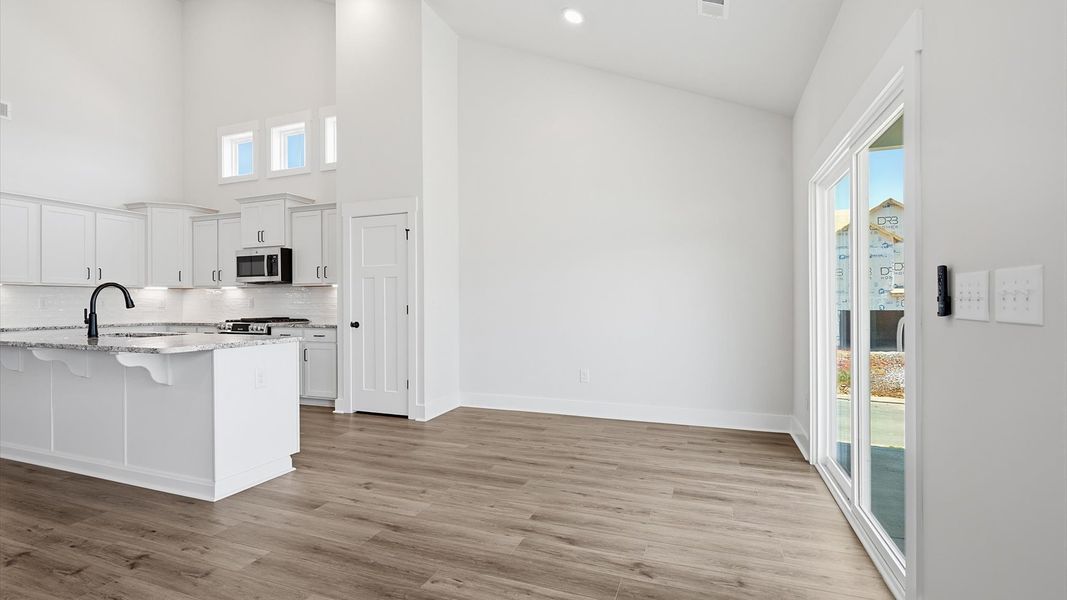 Bright breakfast area seamlessly connecting the kitchen and family room for effortless everyday living. Bright breakfast area seamlessly connecting the kitchen and family room for effortless everyday living.