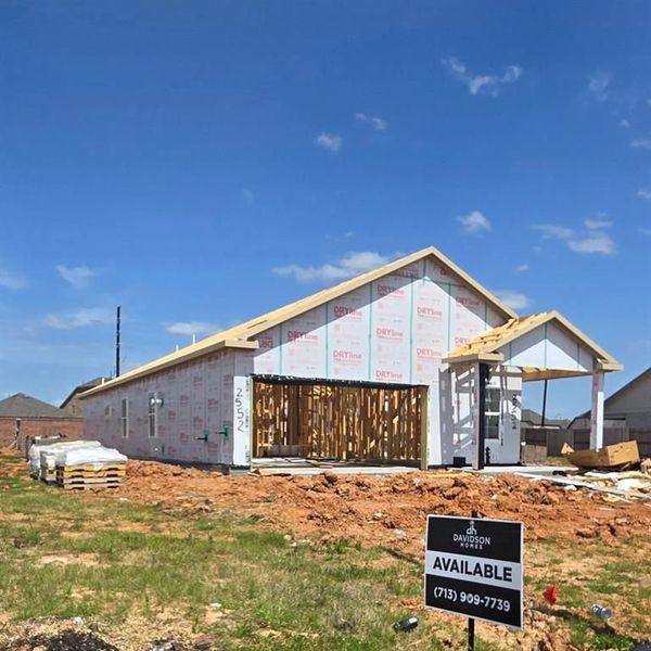 Front exterior of a new home in Sunterra, Katy, TX, highlighting curb appeal (Image 12). Front exterior of a new home in Sunterra, Katy, TX, highlighting curb appeal (Image 12).