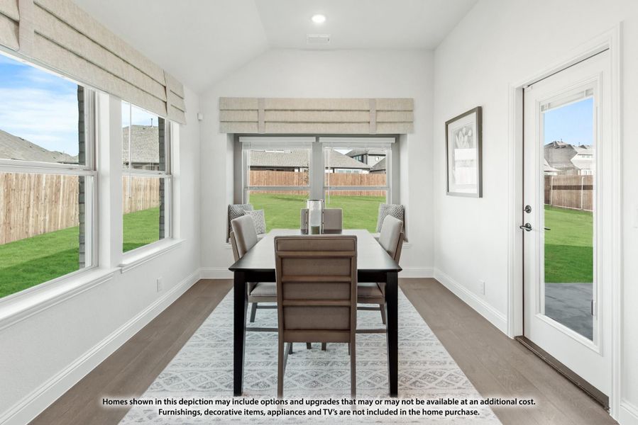 Bright dining room with dark table, four chairs, hardwood floors, and large windows overlooking a backyard. Bright dining room with dark table, four chairs, hardwood floors, and large windows overlooking a backyard.