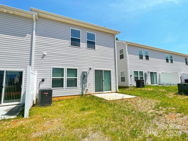 Back of unit with patio & privacy fence