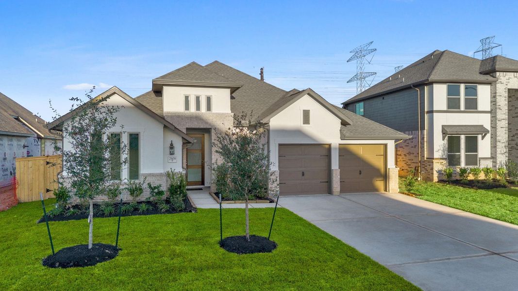 Front exterior of a new home in Coastal Point, League City, TX, highlighting curb appeal (Image 19).
